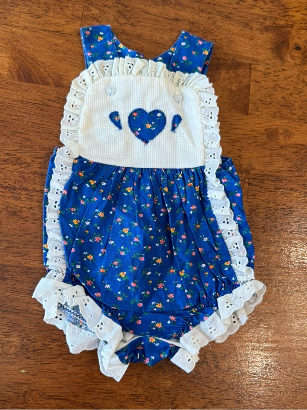 Vintage Blue Floral Baby Romper with White Eyelet Ruffles measures 6-9 months